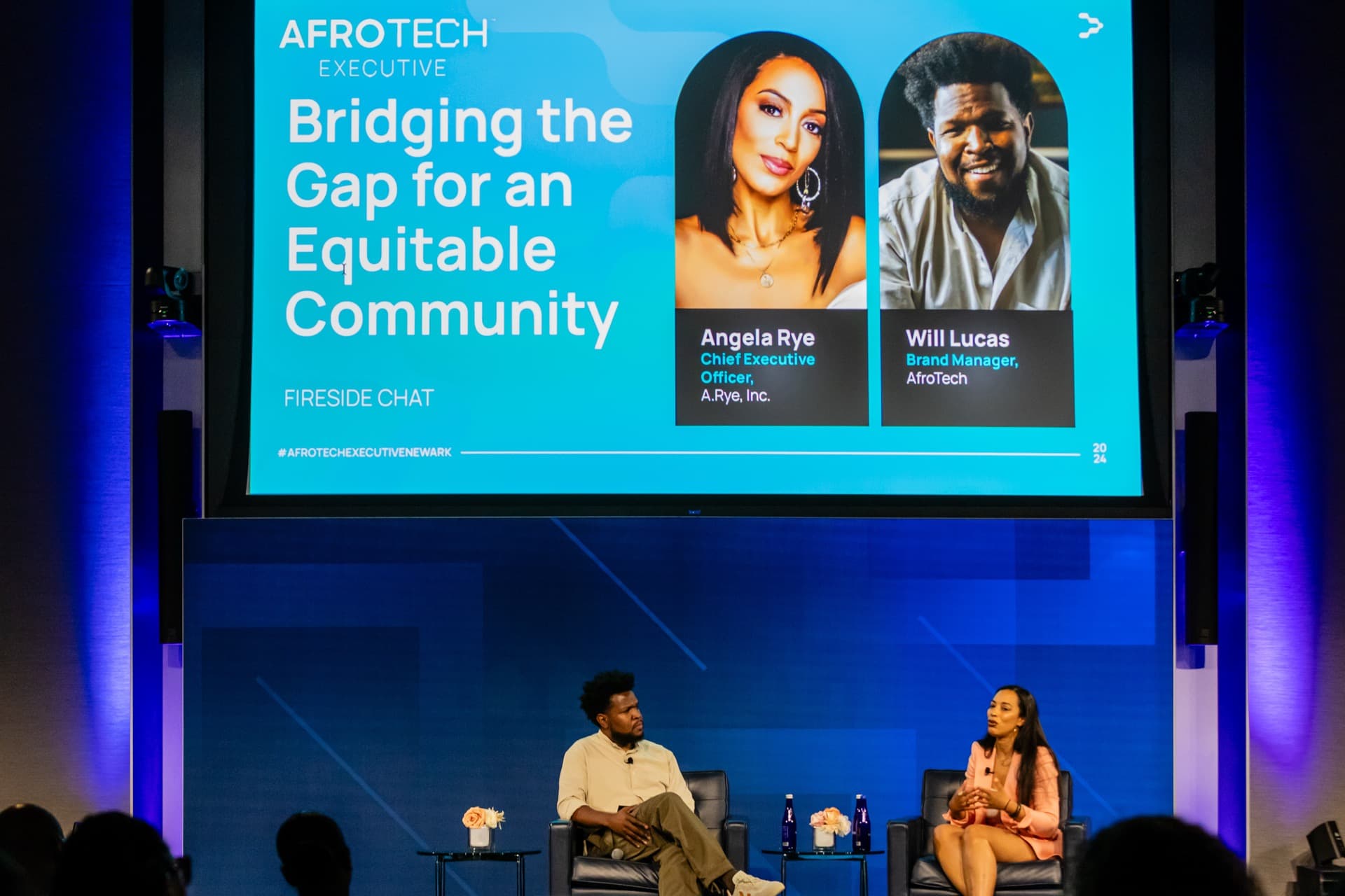 Will Lucas in a fireside chat with Angela Rye on stage at AfroTech Executive Newark 2024.