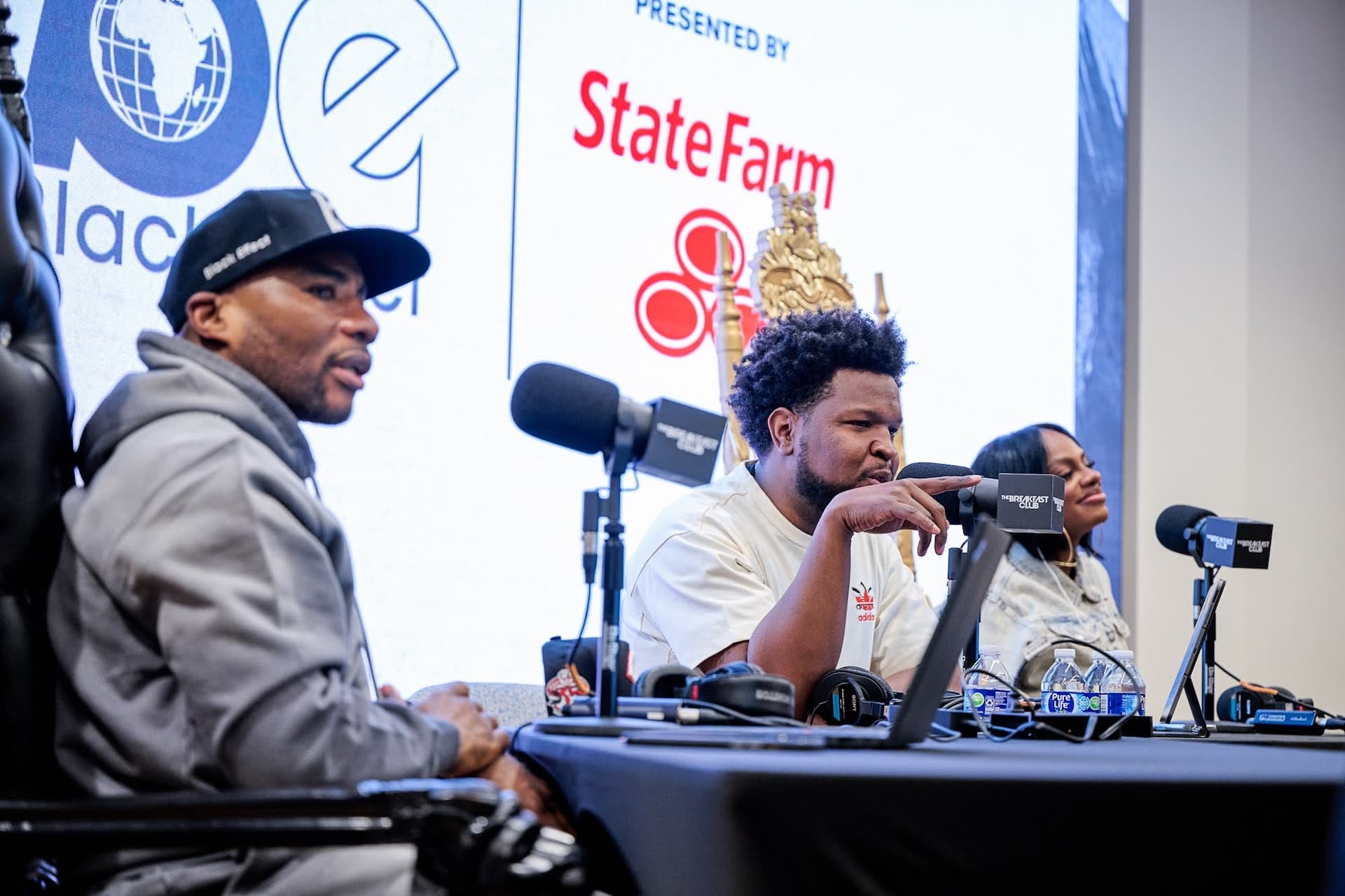 Will Lucas on a live Black Tech Green Money panel presented by State Farm, seated alongside Charlamagne tha God and another guest.